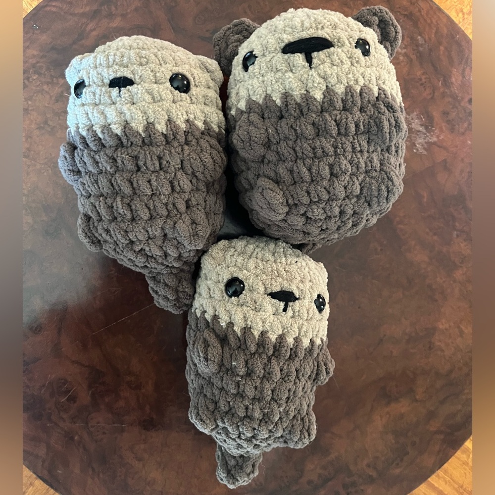Set of three handmade crochet otters